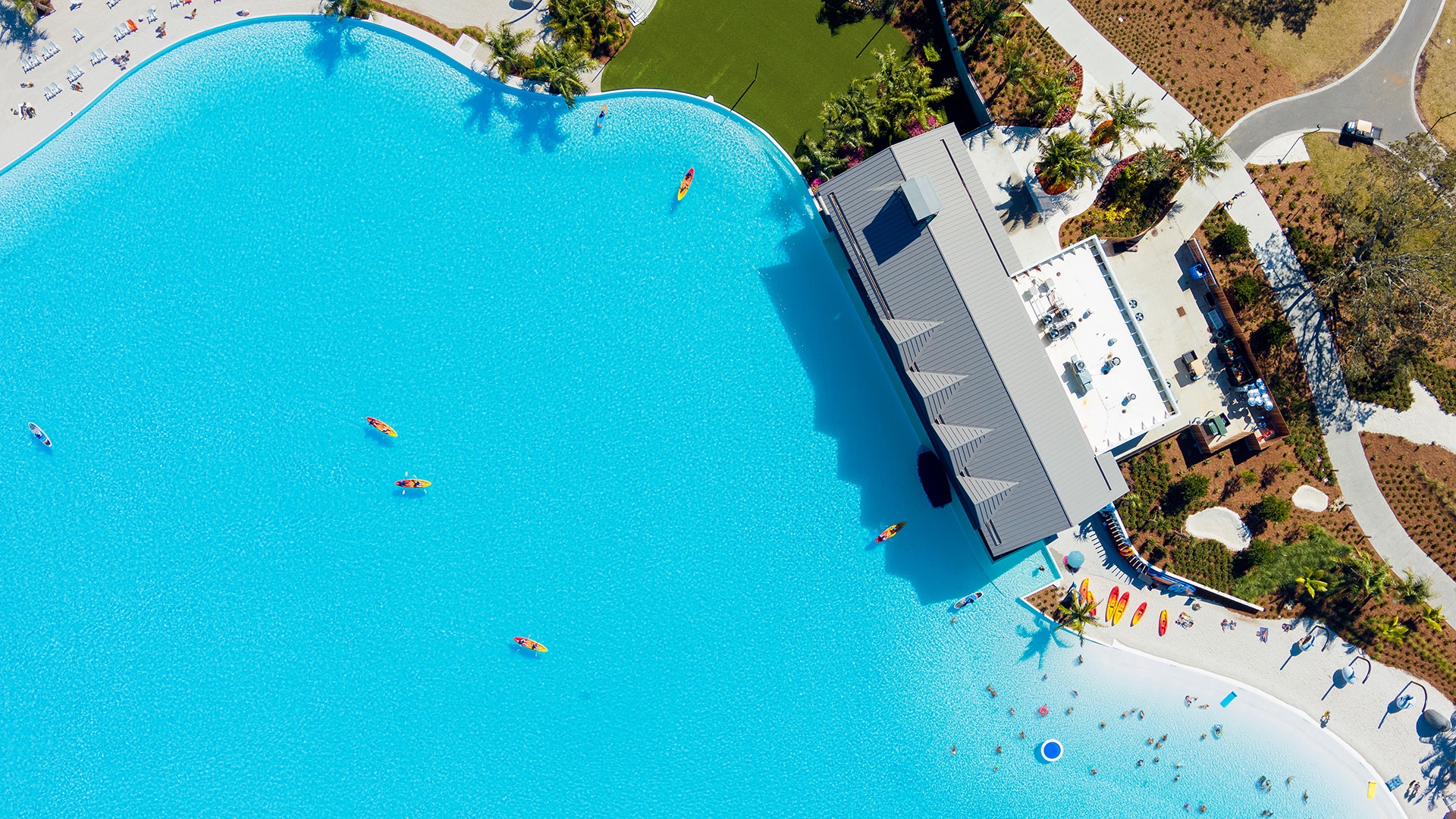 Crystal Lagoons turquoise water and white sand beach at Evermore Orlando Resort, Florida