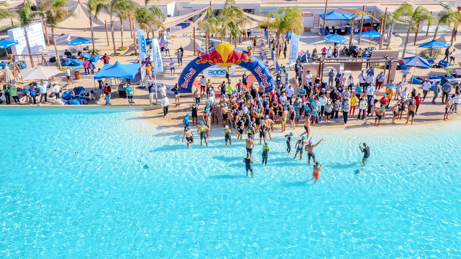 Crowd enjoying a community event on the beach of a PAL® lagoon