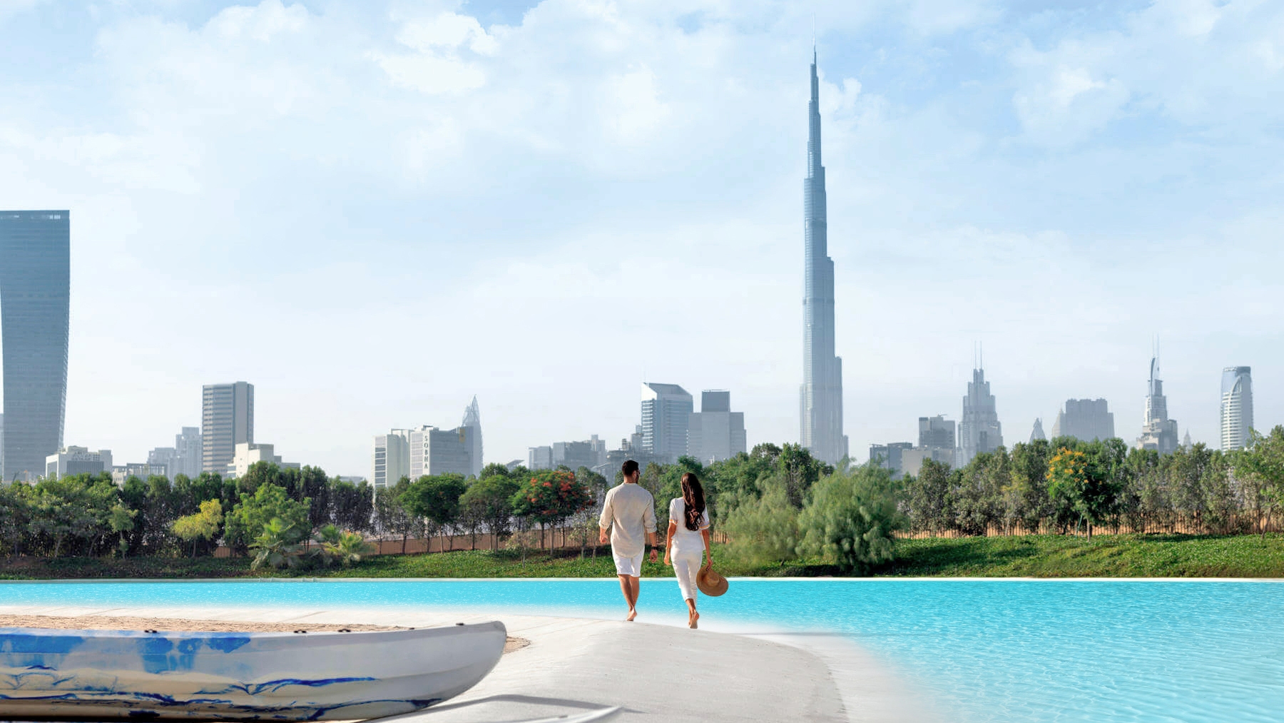 Couple walking on the white sand of the Crystal Lagoons amenity at MBRC District 1, Dubai