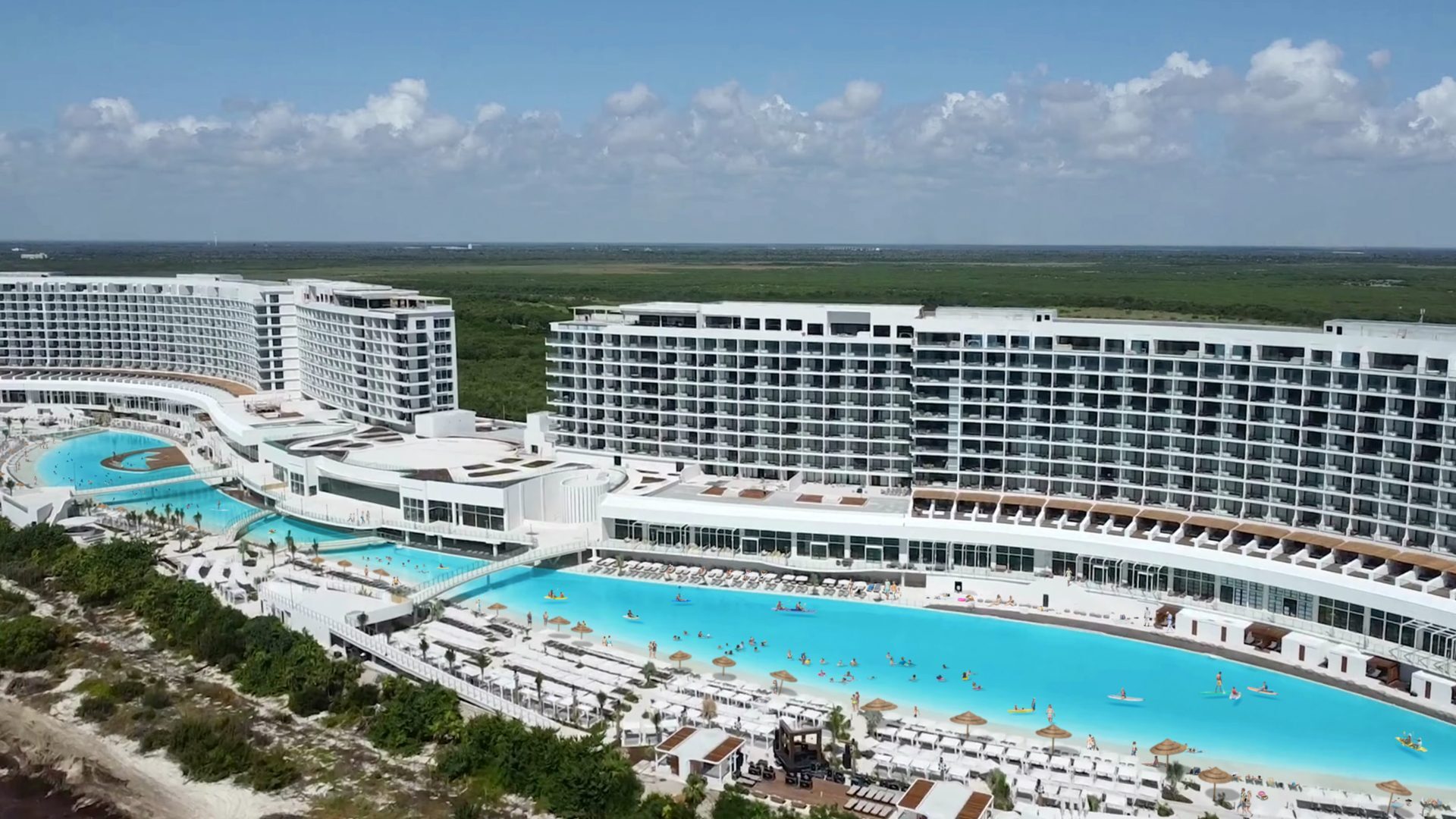 Aerial view of AVA Resort Cancun, all-inclusive beachfront hotel with Crystal Lagoons amenities in Mexico